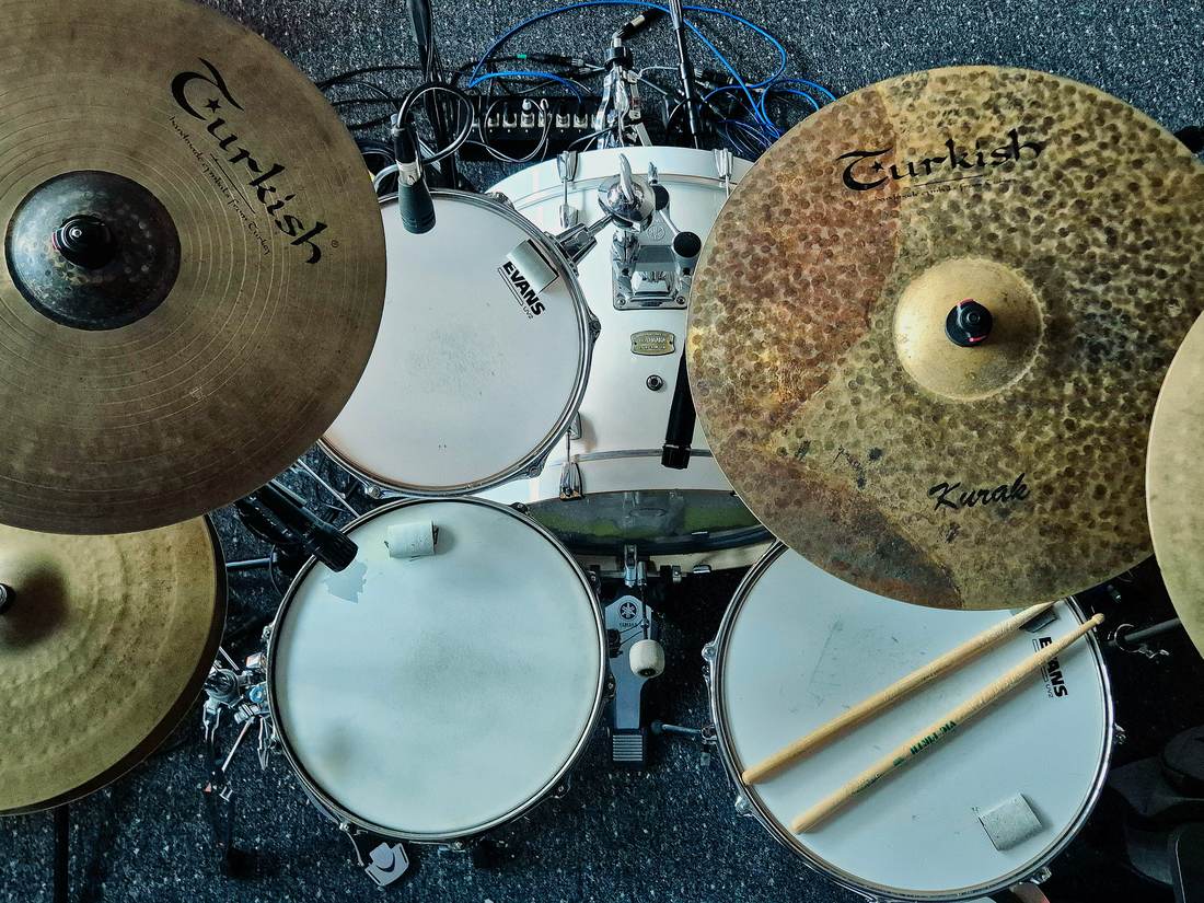 The kit miked and ready, seen from above the drummer's seat.